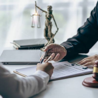 Hammer, judge, lawyer, businessman, scales, god of justice, laptop notebook on table, legal advisor concept Judge with justice lawyers having team meeting at office background